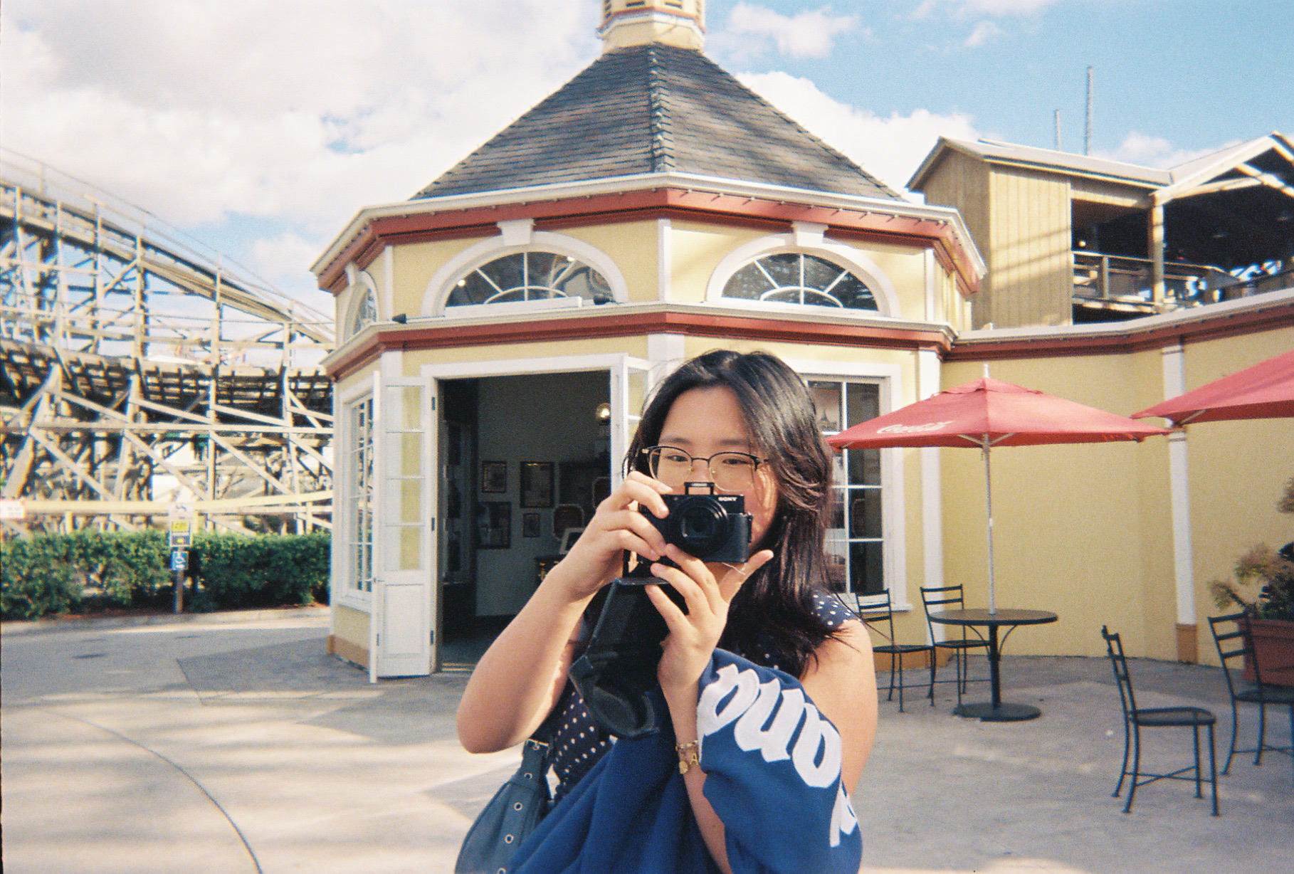 Annette holding a camera outside