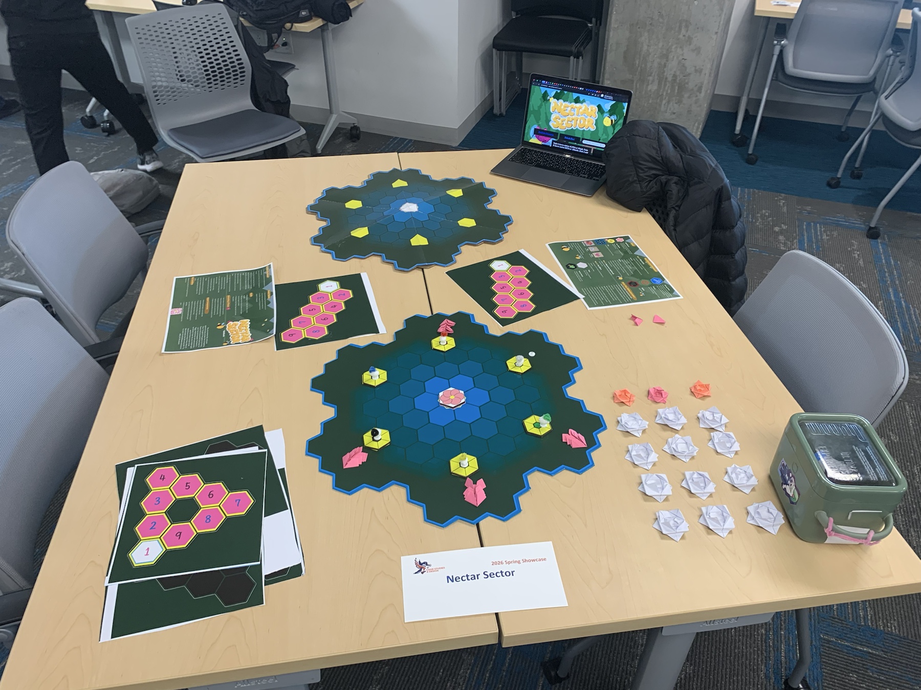 The handmade Nectar Sector board game, boards, pieces, and player materials arranged on a table