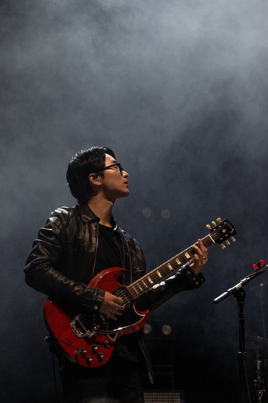Wave to Earth guitarist playing a red guitar